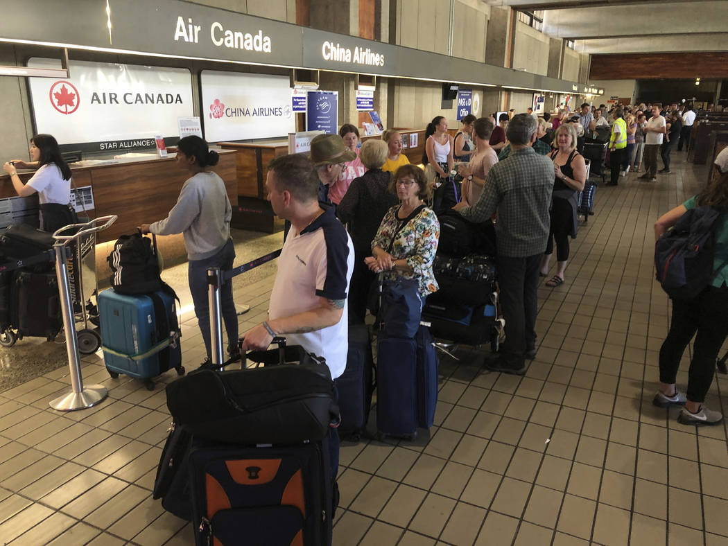 Passengers from an Australia-bound Air Canada flight diverted to Honolulu Thursday, July 11, 20 ...