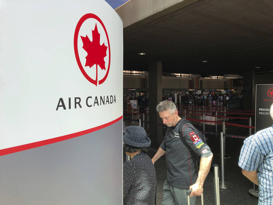 Passengers from an Australia-bound Air Canada flight diverted to Honolulu Thursday, July 11, 20 ...