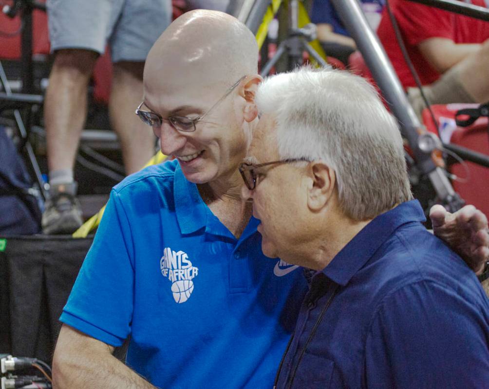NBA Commissioner Adam Silver talks to Summer League Executive director Warren LeGarie during th ...
