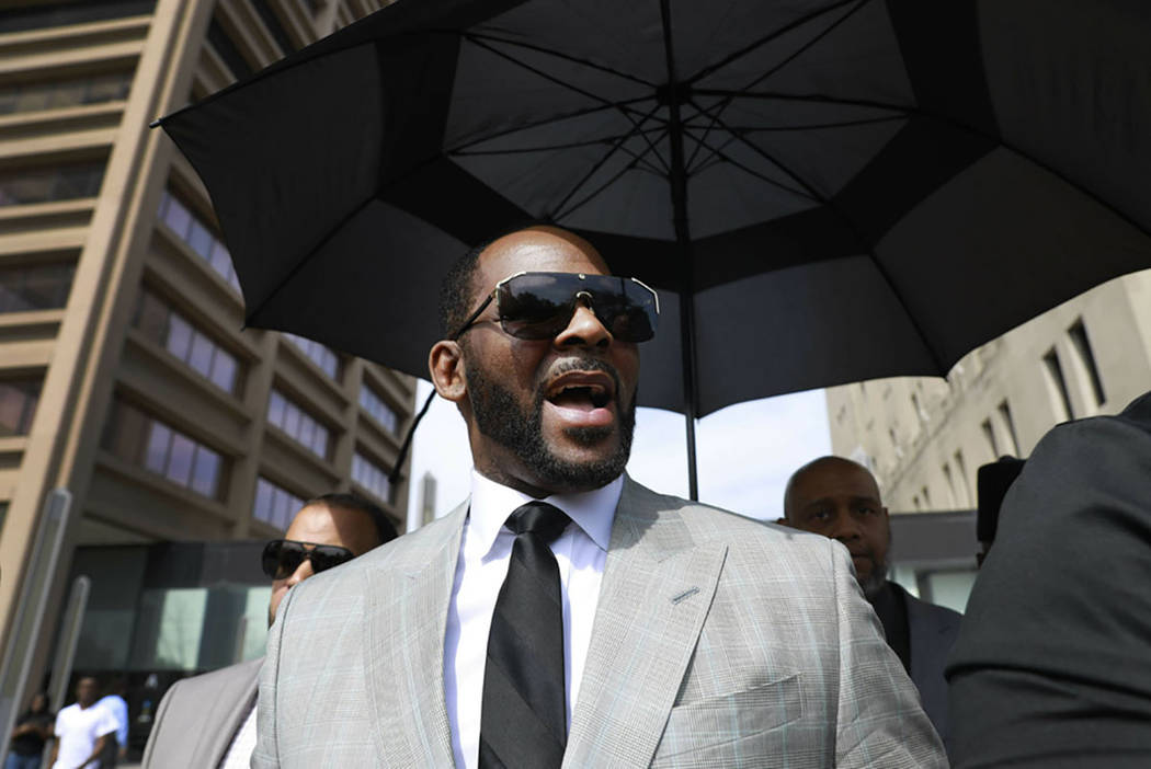 Musician R. Kelly departs the Leighton Criminal Court building after pleading not guilty to 11 ...