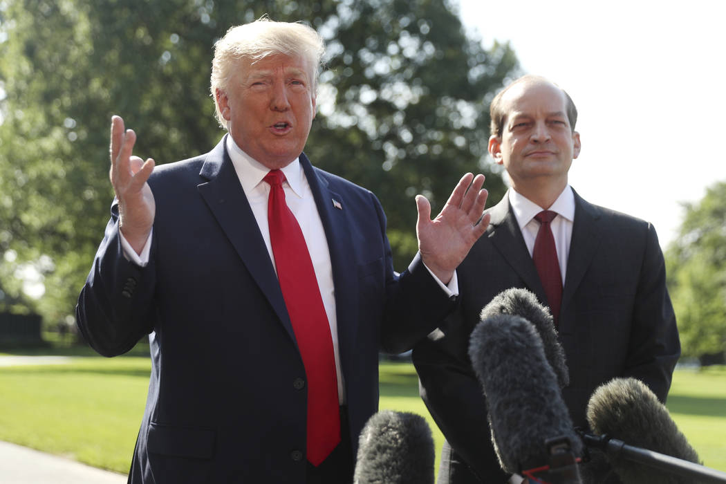 President Donald Trump speaks to members of the media with Secretary of Labor Alex Acosta on th ...