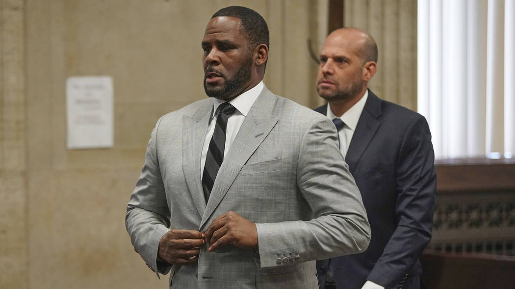FILE - In this June 6, 2019, file photo, singer R. Kelly pleaded not guilty to 11 additional s ...