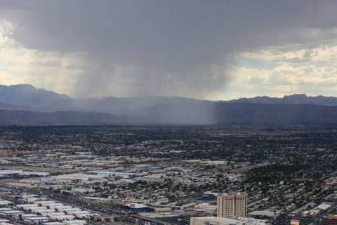 A rain shower passes over Summerlin in Las Vegas on Friday, July 12, 2019. Brett Le Blanc/Las V ...