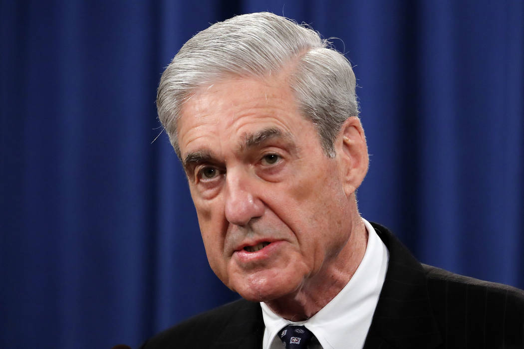 In a May 29, 2019, file photo, Special counsel Robert Mueller speaks at the Department of Justi ...