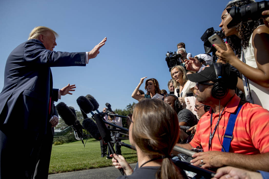 President Donald Trump speaks to members of the media on the South Lawn of the White House in W ...