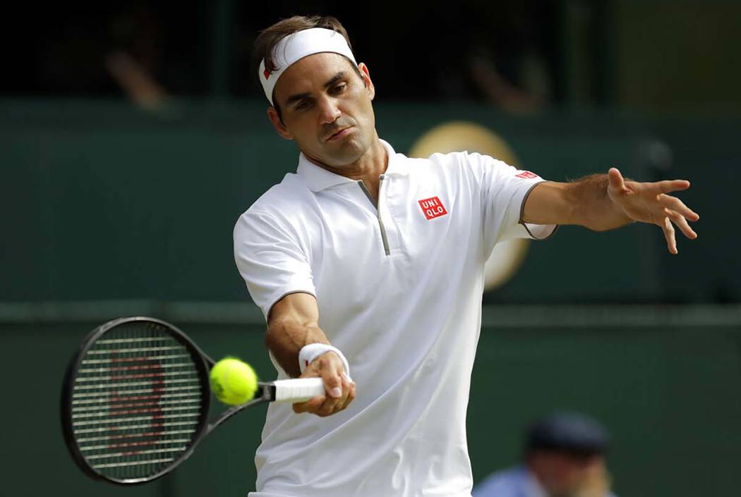 Switzerland's Roger Federer returns the ball to Spain's Rafael Nadal during a men's singles sem ...
