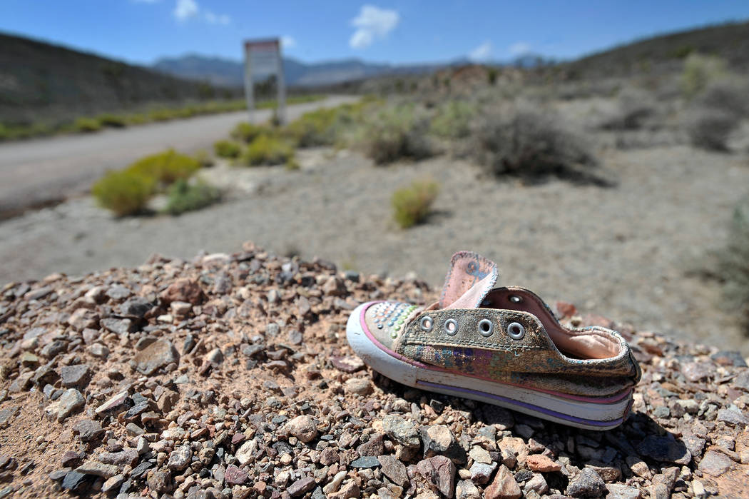 A child's shoe is seen near the perimeter of the well-guarded military installation on Tuesday, ...