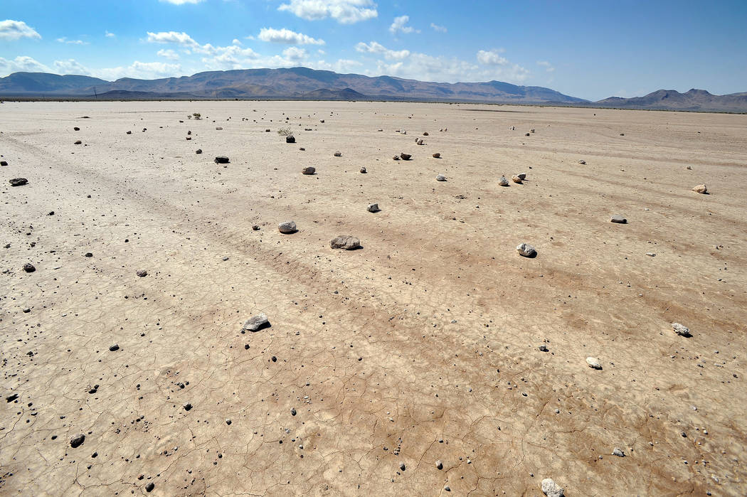 Rocks scattered over the Delamar Dry Lake are seen on Tuesday, Aug. 5, 2014. Over the years the ...