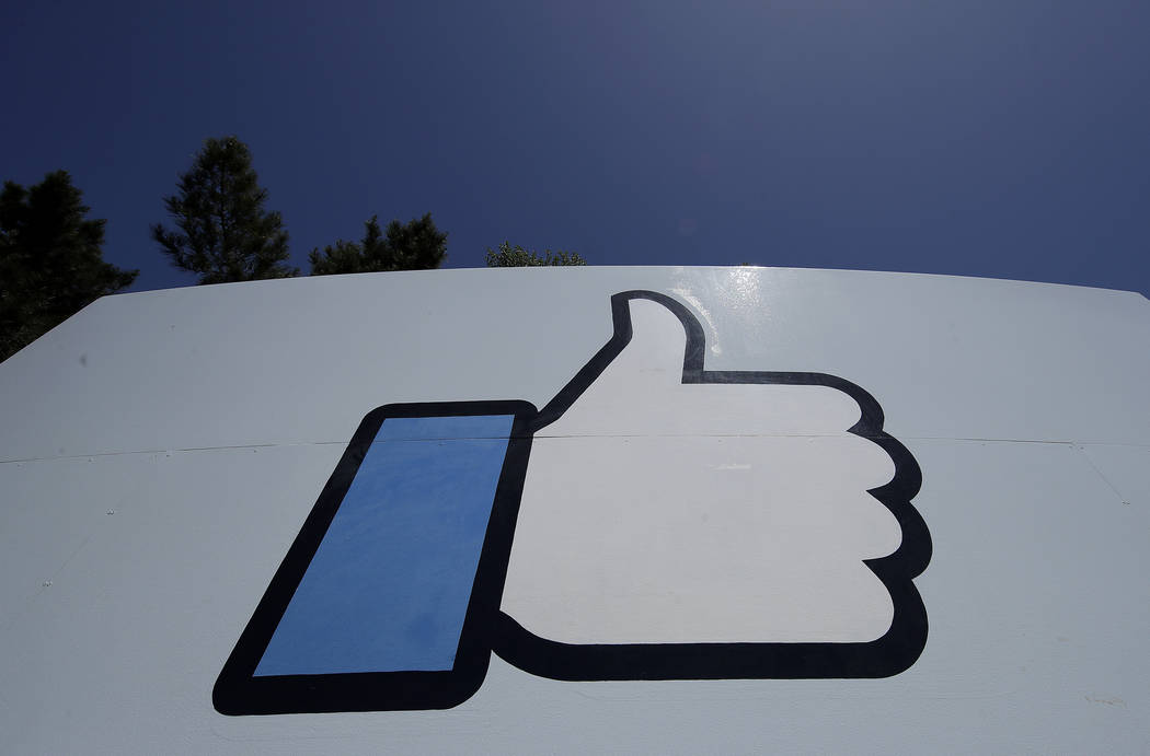 An April 25, 2019, file photo shows the thumbs-up "Like" logo on a sign at Facebook headquarter ...