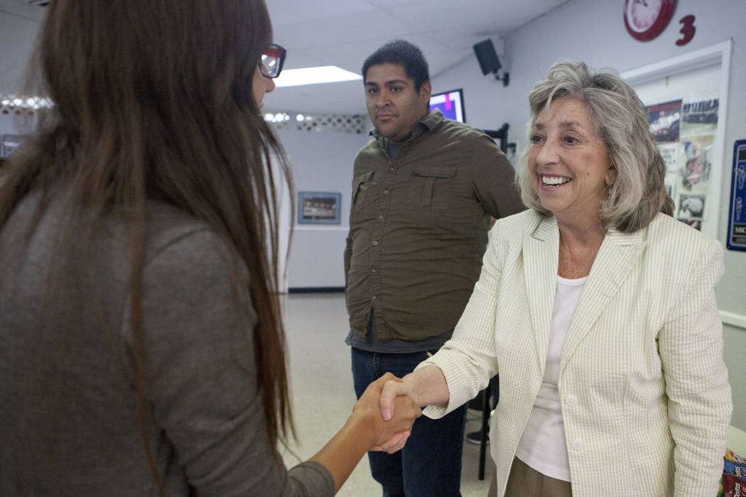 Rep. Dina Titus, D-Nev., right, shakes hands with Cynthia Salgado, 17, as Martin Macias-Rivera ...