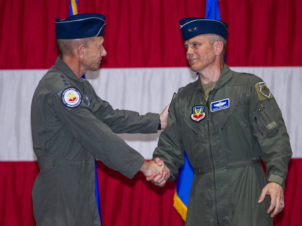 Gen. Mike Holmes, Commander of Air Combat Command, left, and Maj. Gen. Charles Corcoran shake ...