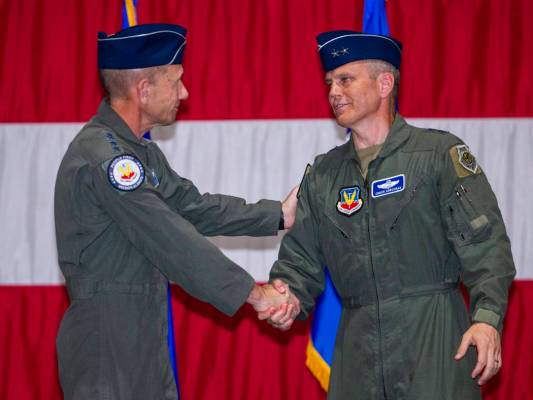 Gen. Mike Holmes, Commander of Air Combat Command, left, and Maj. Gen. Charles Corcoran shake ...
