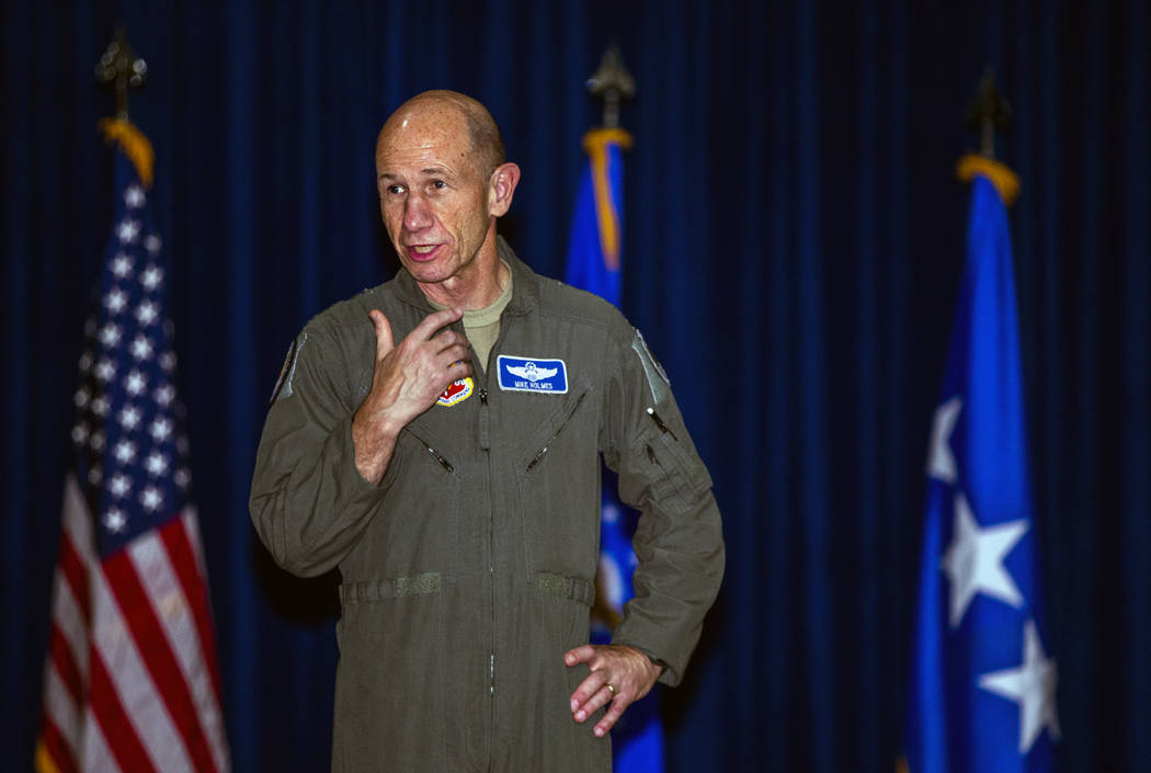 Gen. Mike Holmes, Commander of Air Combat Command, speaks on behalf of Staff Sgt. Kenneth DeLon ...