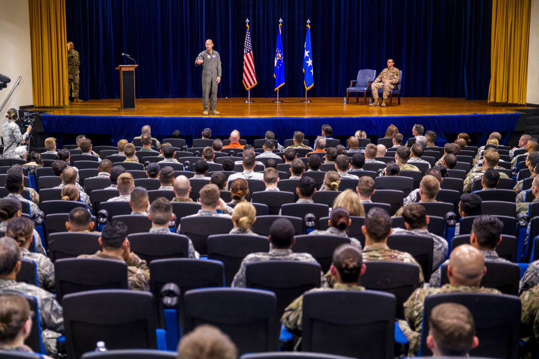 Gen. Mike Holmes, Commander of Air Combat Command, speaks on behalf of Staff Sgt. Kenneth DeLon ...