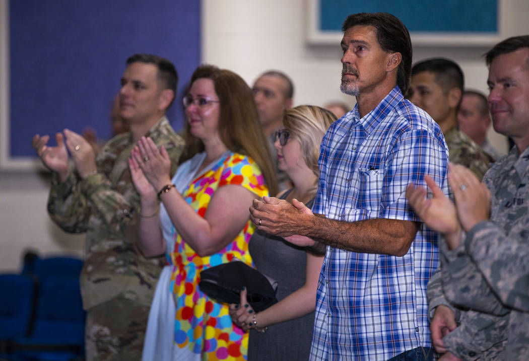 Ken DeLongchamp, right in plaid, applauds at Nellis Air Force Base on Friday, July 12, 2019, in ...