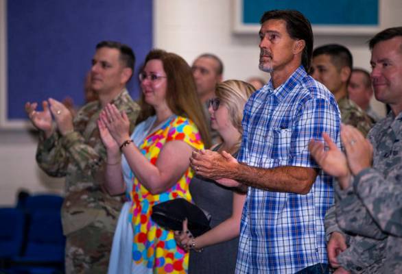 Ken DeLongchamp, right in plaid, applauds at Nellis Air Force Base on Friday, July 12, 2019, in ...
