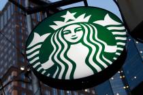 A Starbucks sign outside a Starbucks coffee shop in downtown Pittsburgh. (AP Photo/Gene J. Puskar)