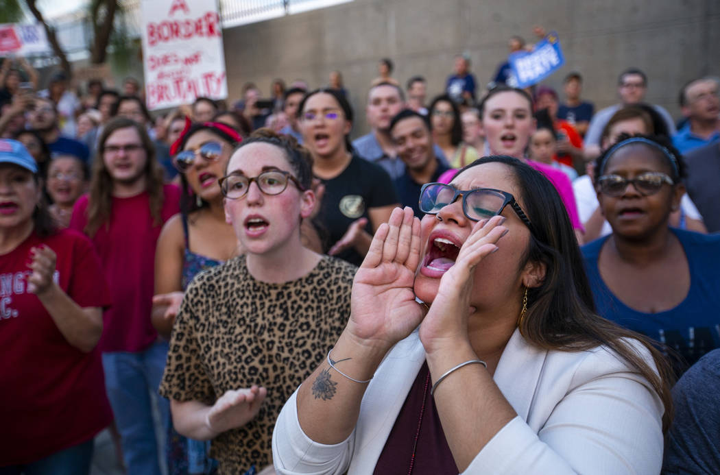 Activist Cecelia Gonzalez yells out a chant response during Lights for Liberty: A Vigil to End ...