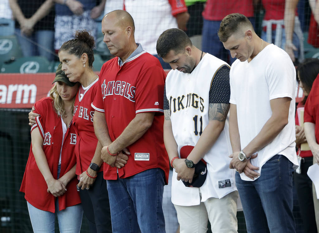 Members of Tyler Skaggs' family, including wife, Carli, left; mother, Debbie, second from left; ...