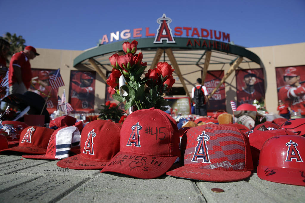 A makeshift shrine in honor of Los Angeles Angels pitcher Tyler Skaggs stands outside Angel Sta ...