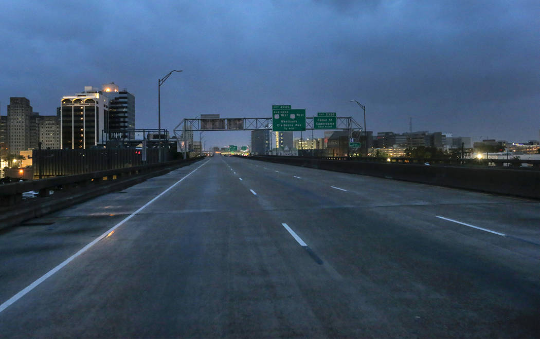 The I-10 in New Orleans is nearly empty of traffic as the eye of Tropical Storm Barry nears the ...