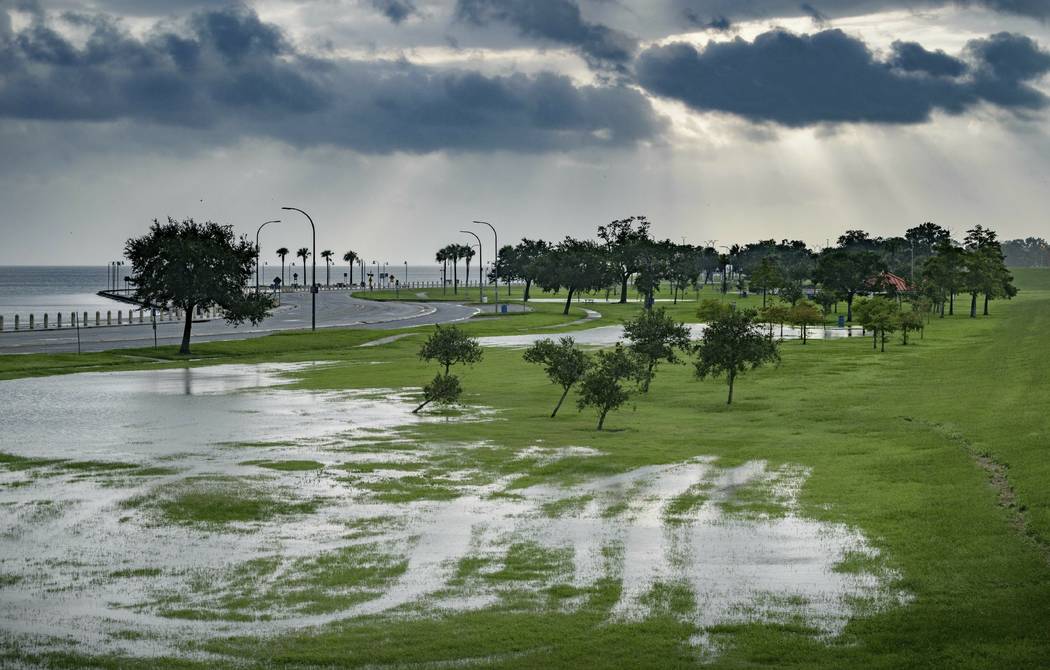 The sky is cloudy as over Lake Pontchartrain on Lakeshore Drive as little flooding is reported ...