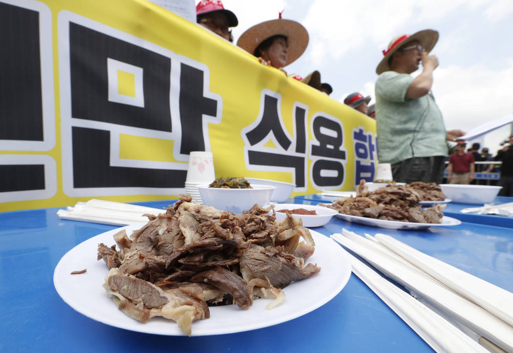 Members of the Korean Dog Meat Association stage a rally to support eating dog meat in front of ...