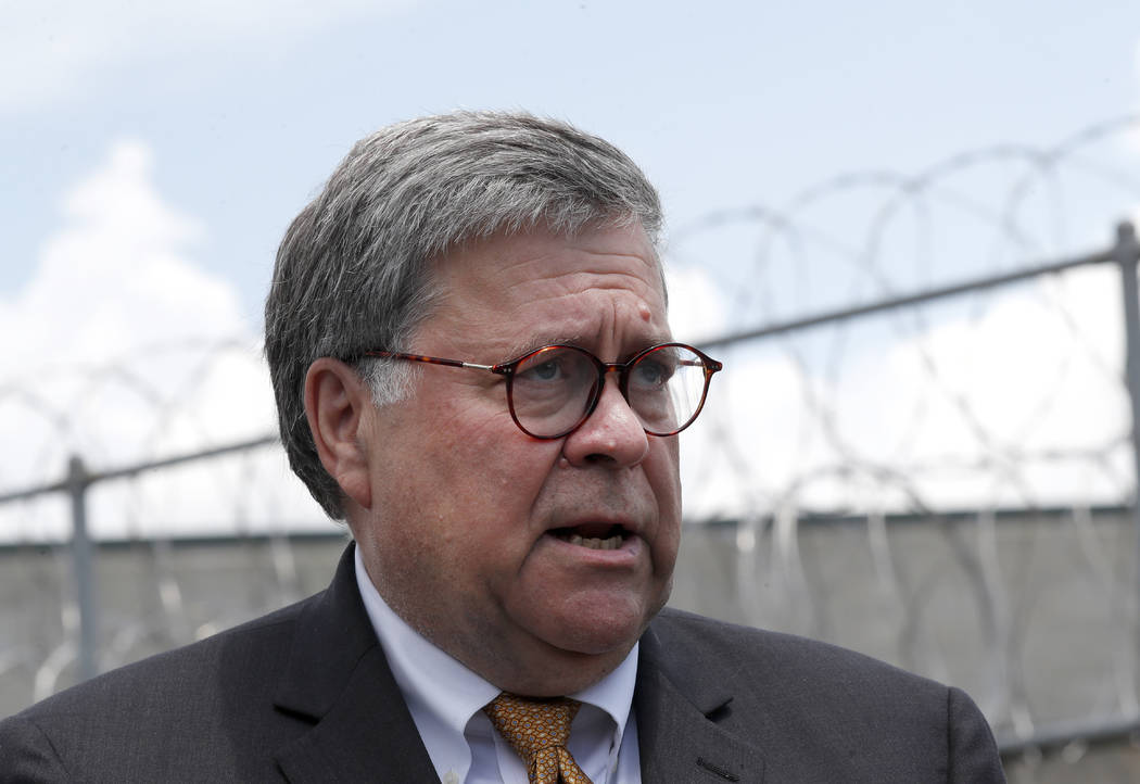 Attorney General William Barr speaks to reporters after a tour of a federal prison Monday, July ...