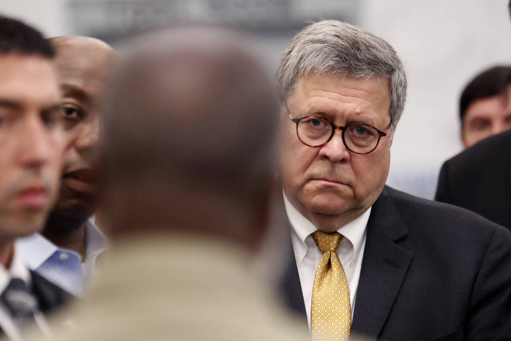 Attorney General William Barr listens as an inmate talks about the First Step Back program duri ...