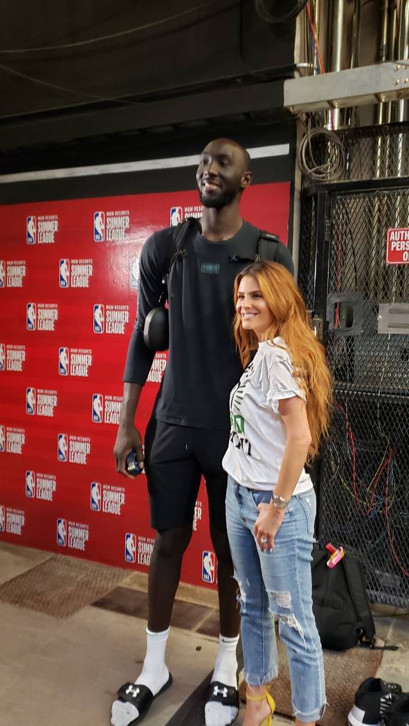 TV personality Maria Menounos poses Saturday with Tacko Fall of the Boston Celtics. (Photo by M ...