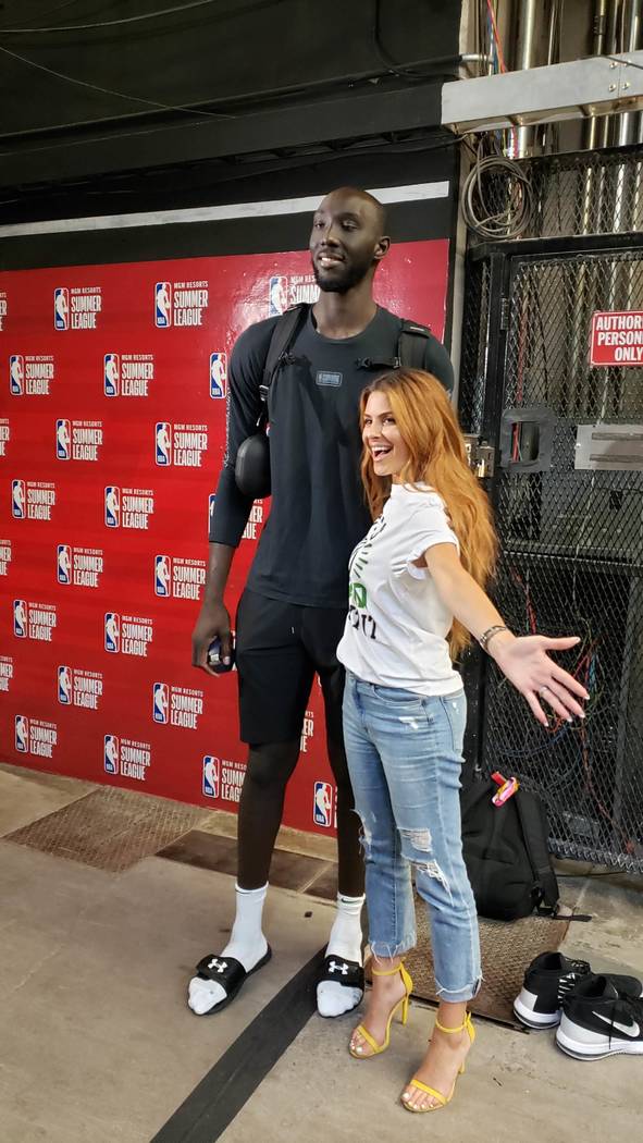 TV personality Maria Menounos poses Saturday with Tacko Fall of the Boston Celtics. (Photo by M ...