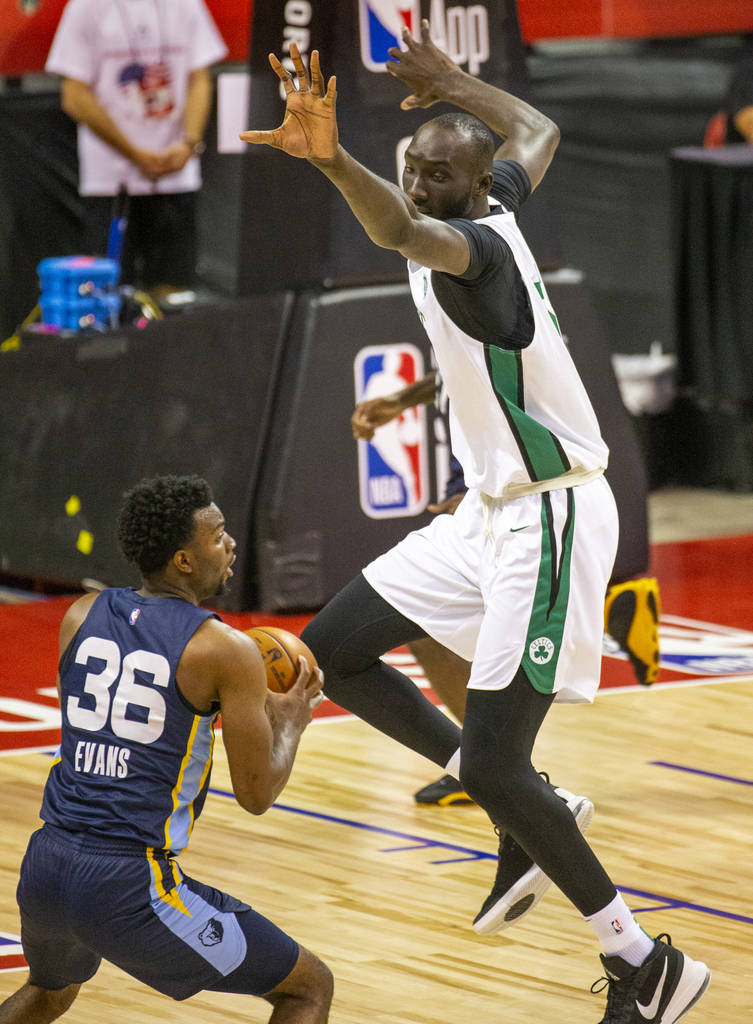 Boston Celtics center Tacko Fall defends a possible shot by Memphis Grizzlies guard Keenan Evan ...