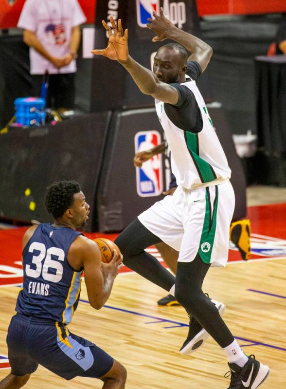 Boston Celtics center Tacko Fall defends a possible shot by Memphis Grizzlies guard Keenan Evan ...