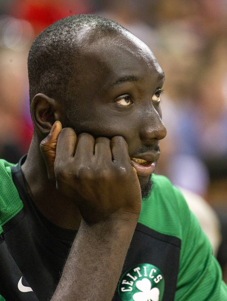 Boston Celtics center Tacko Fall watches from the bench as the Memphis Grizzlies pull ahead dur ...