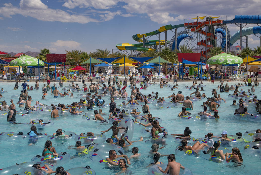 Revelers enjoy the Surf-A-Rama Wave Pool at Cowabunga Bay water park in Henderson, Sunday, July ...