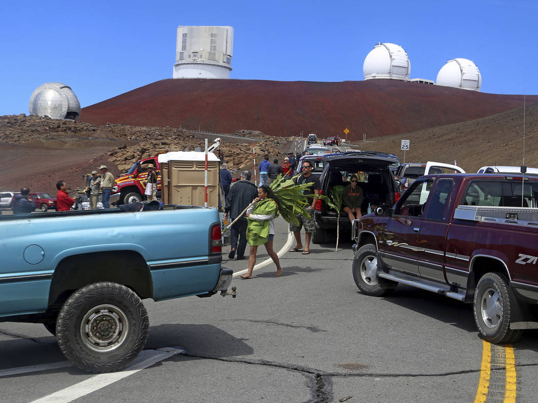 Protesters block vehicles from getting to the Thirty Meter Telescope groundbreaking ceremony si ...