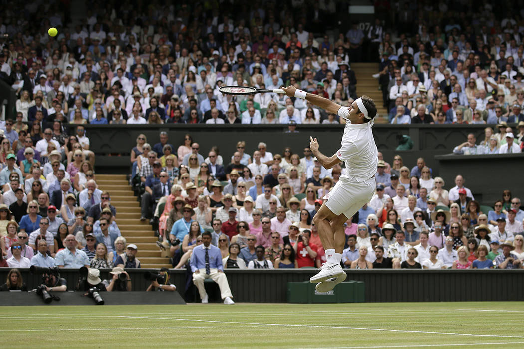 Switzerland's Roger Federer returns the ball to Serbia's Novak Djokovic during the men's single ...