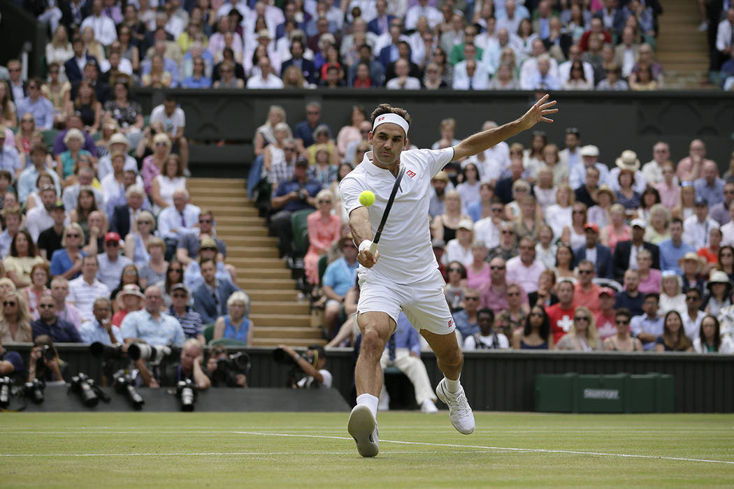 Switzerland's Roger Federer returns the ball to Serbia's Novak Djokovic during the men's single ...