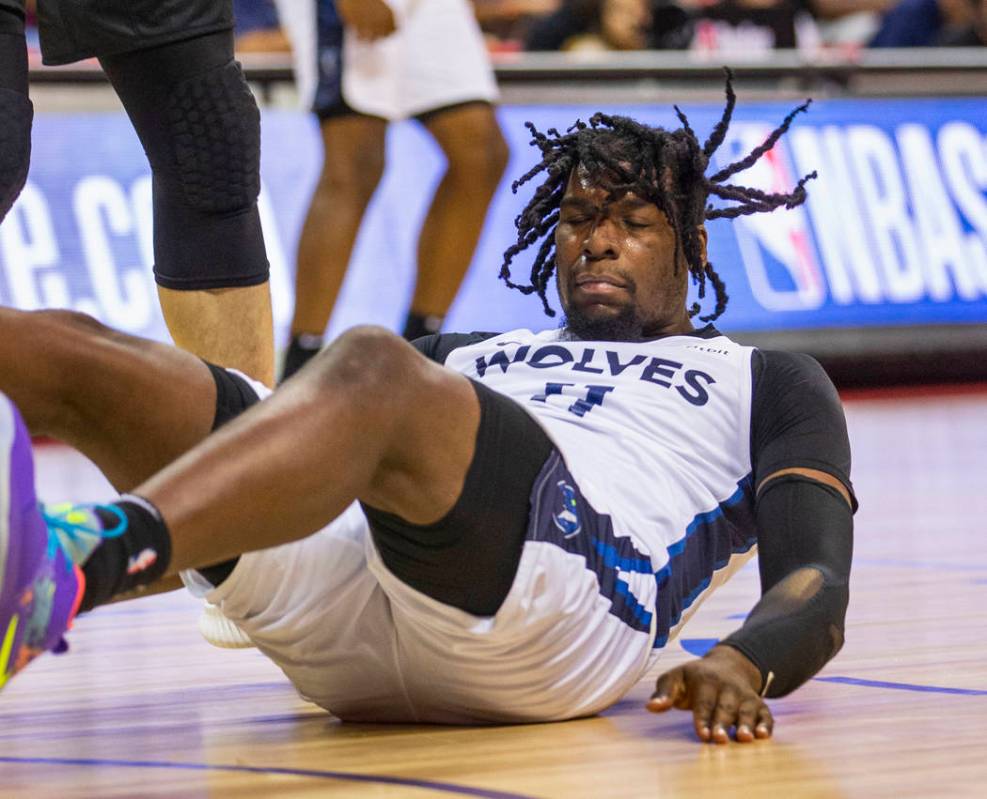 Minnesota Timberwolves center Naz Reid crashes to the court versus the Brooklyn Nets during the ...