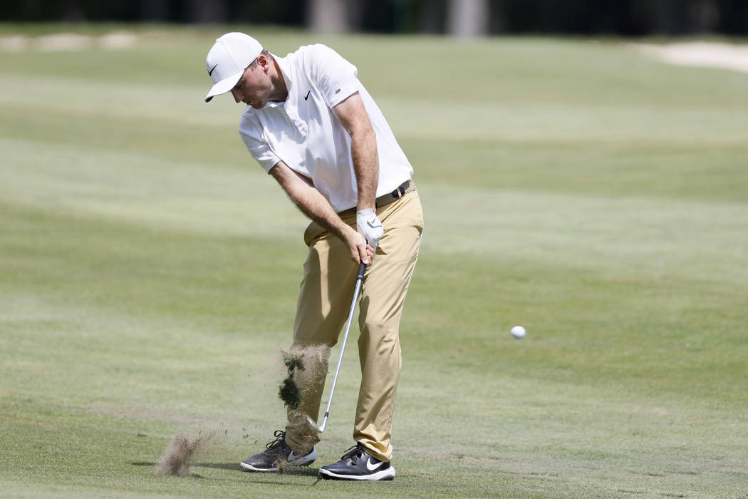 Russell Henley hits to the 18th green during the final round of the John Deere Classic golf tou ...