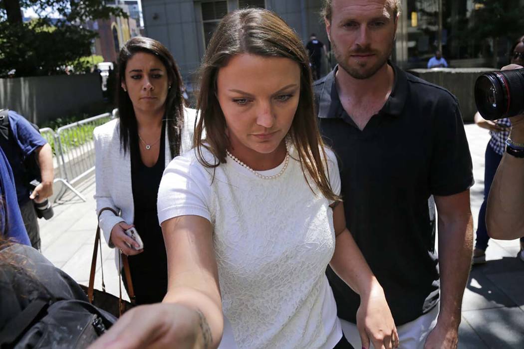 Courtney Wild, center, an accuser of Jeffery Epstein, leaves the courthouse in New York, Monday ...