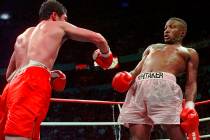 In an April 12, 1997, file photo, Pernell Whitaker, right, leans away from a punch by Oscar De ...