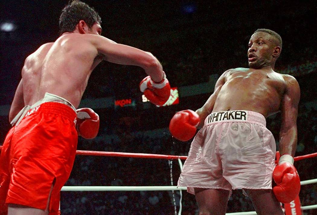 In an April 12, 1997, file photo, Pernell Whitaker, right, leans away from a punch by Oscar De ...