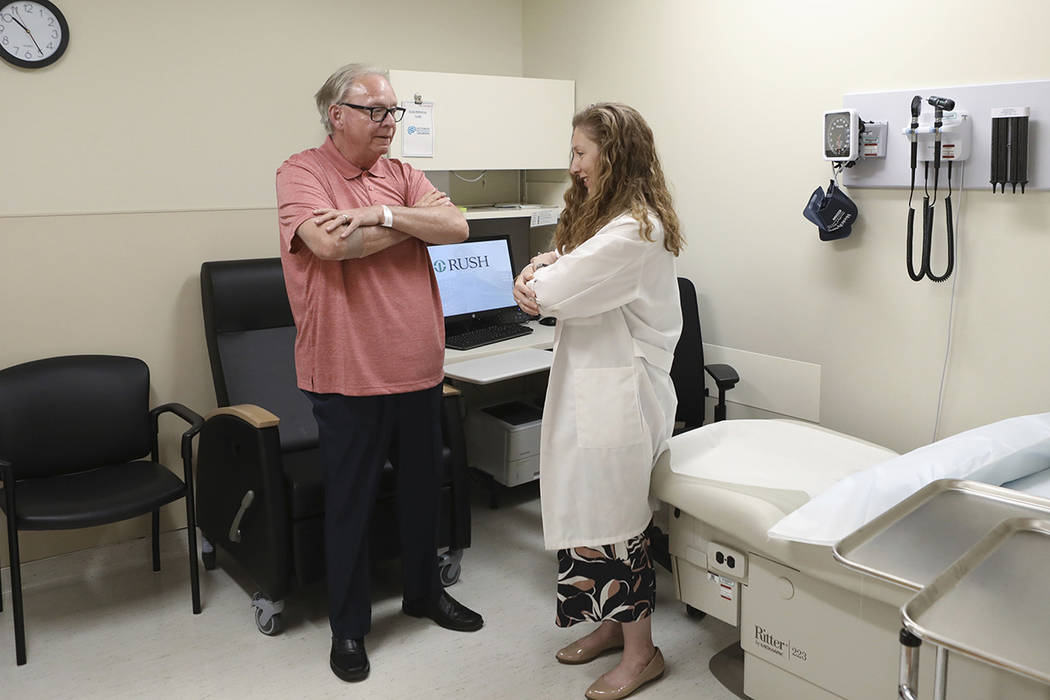 In this July 9, 2019 photo, Dr. Jori Fleisher, neurologist, examines Thomas Doyle, 66, at the R ...