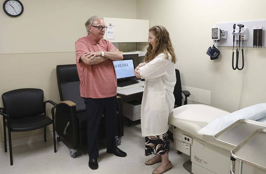 In a July 9, 2019 photo, Dr. Jori Fleisher, neurologist, examines Thomas Doyle, 66, at the Rush ...