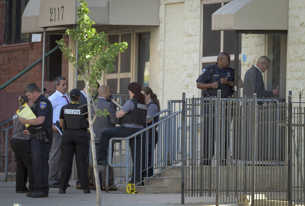 Baltimore Police investigate the scene of a shooting at the Man Alive drug treatment center on ...