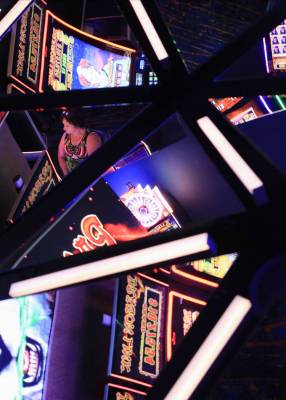 Slot machines are reflected in the ceiling of the Link Slot Lounge, a new gaming area at The ST ...