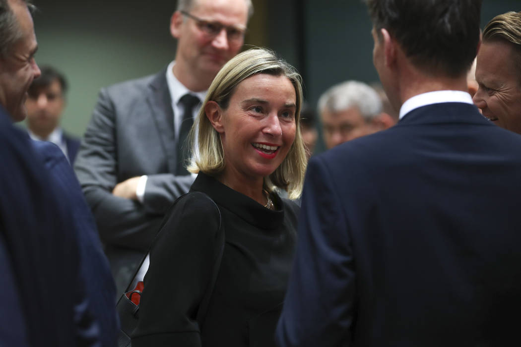 European Union foreign policy chief Federica Mogherini, center, arrives for a European Foreign ...