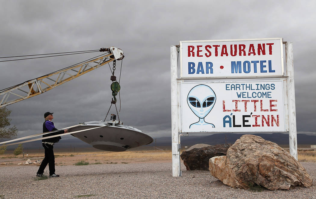 Jim Bennett inspects the flying saucer outstide the Roadrunner Internationale conference at the ...