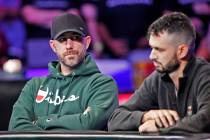 Garry Gates, left, and Alex Livingston, right, on the second day of the main event final table ...